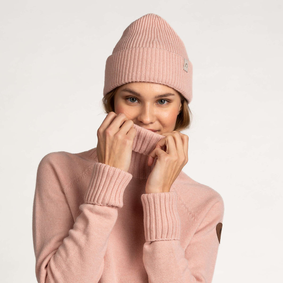 North Outdoor Huuru merino čepice v barvě pudrově růžové, bez mulesingu merino vlna. Vyrobeno ve Finsku. -