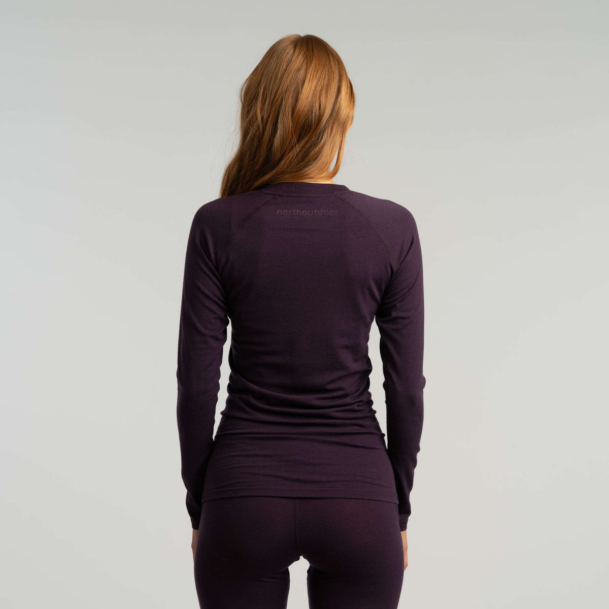 North Outdoor Motion 150 women's merino base layer shirt in aubergine, mulesing-free merino wool. Designed in Finland. - Model is 173 cm and wears size S