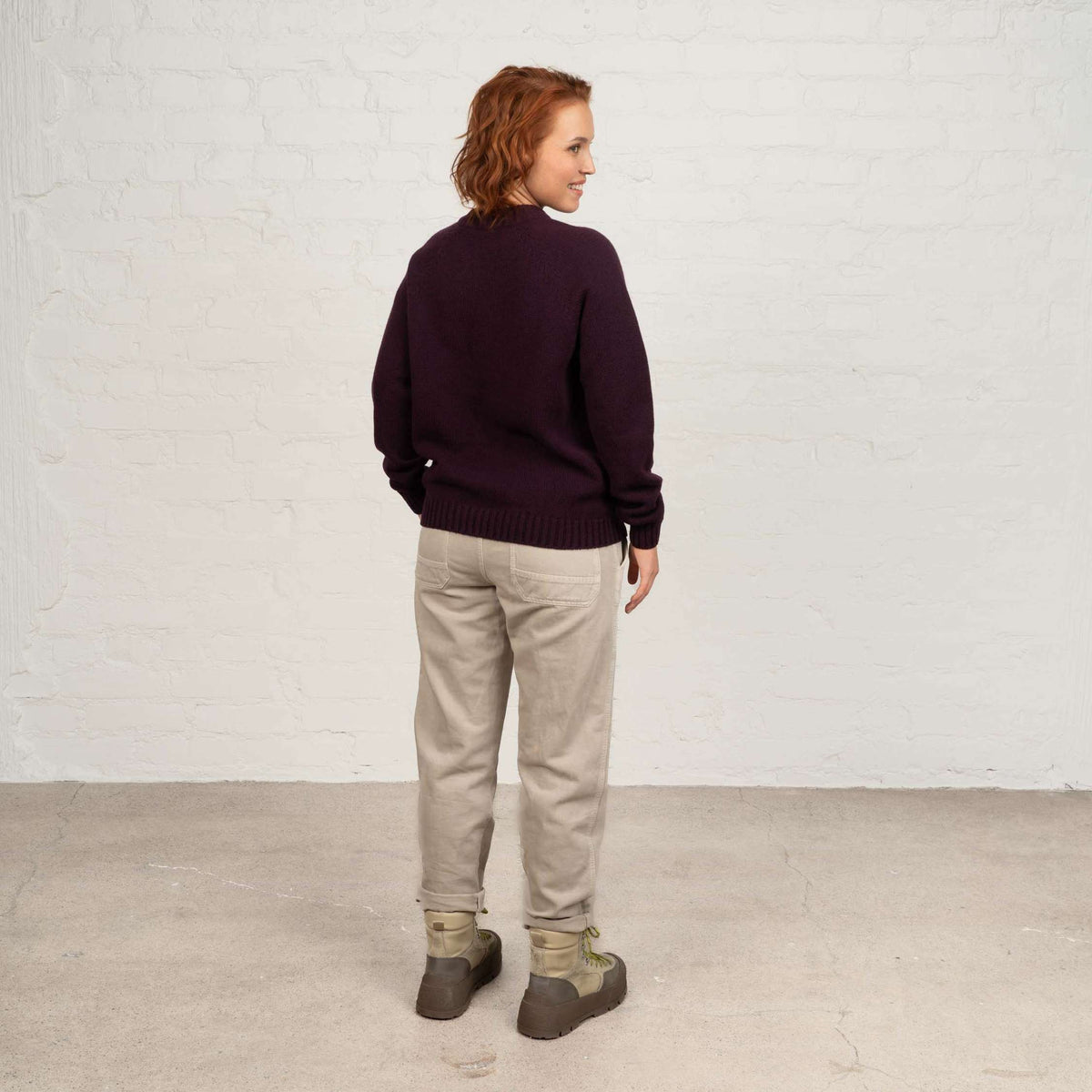 North Outdoor Viima Women's merino wool sweater in blackcurrant, mulesing-free merino wool. Made in Finland. - Model is 173 cm tall and wears size M
