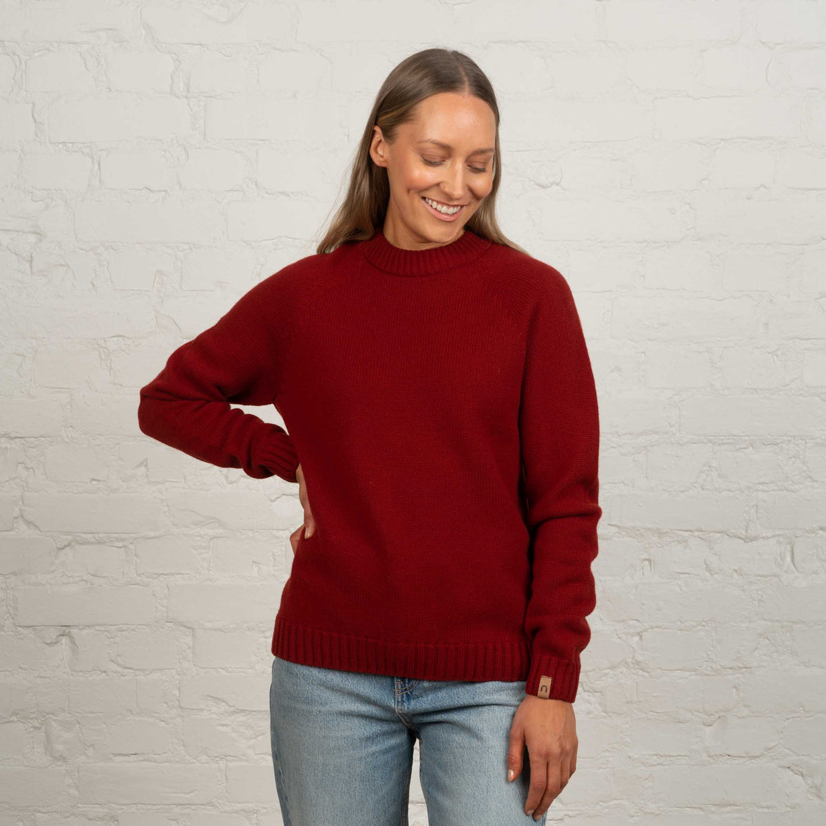 North Outdoor Viima women's merino wool sweater in chili mulesing-free merino wool. Made in Finland. - Model is 174 cm and wears size M