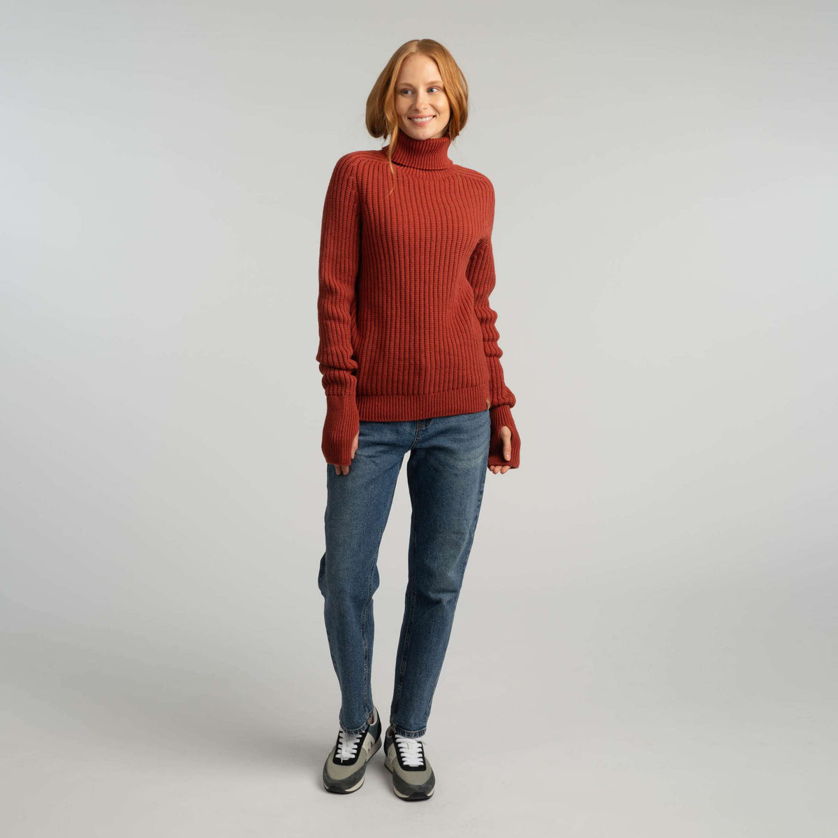 North Outdoor Havina women's merino turtleneck in terracotta, mulesing-free merino wool. Made in Finland. - Model is 173 cm and wears size M