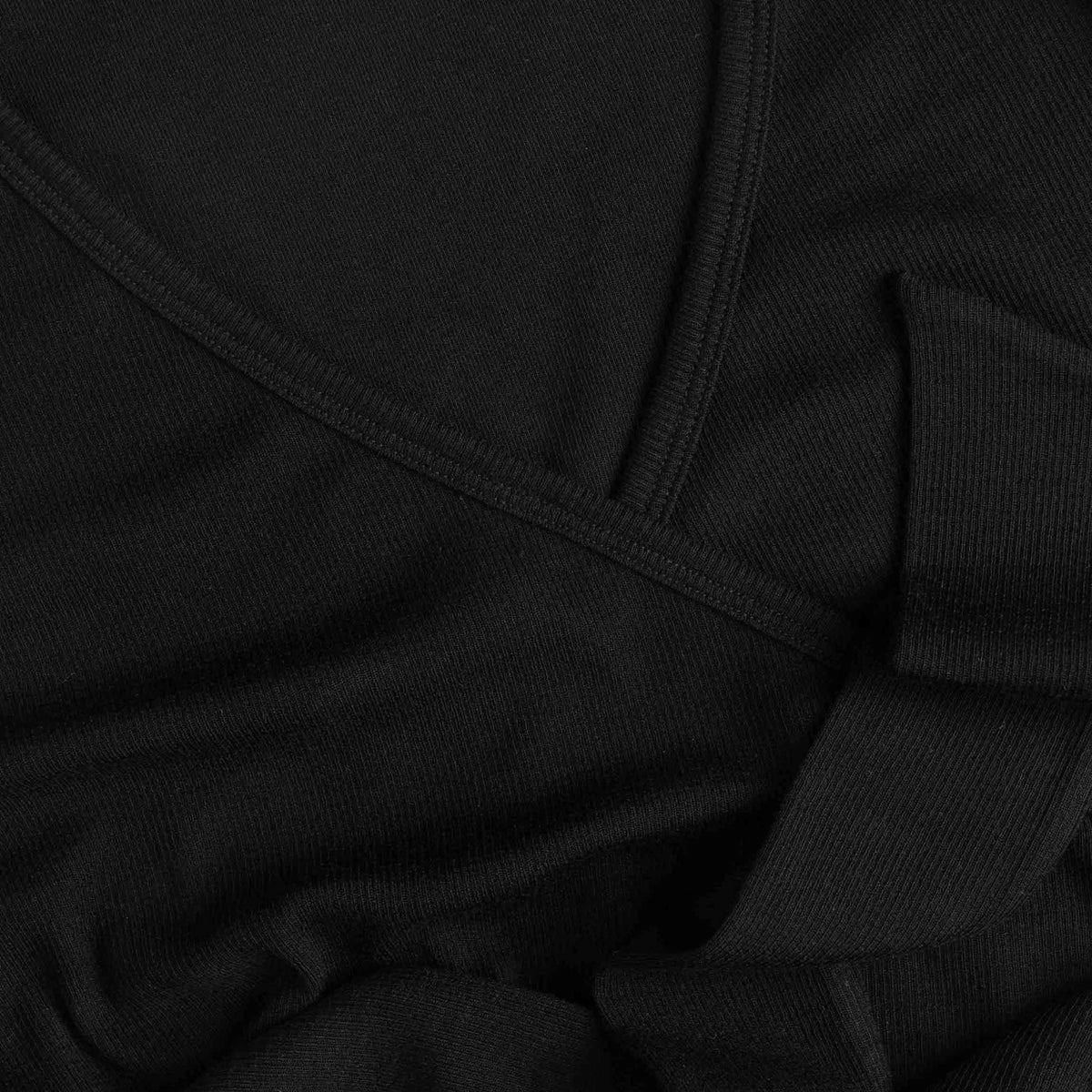 North Outdoor Lou women's merino wrap top in black, mulesing-free merino wool. Designed in Finland. - 