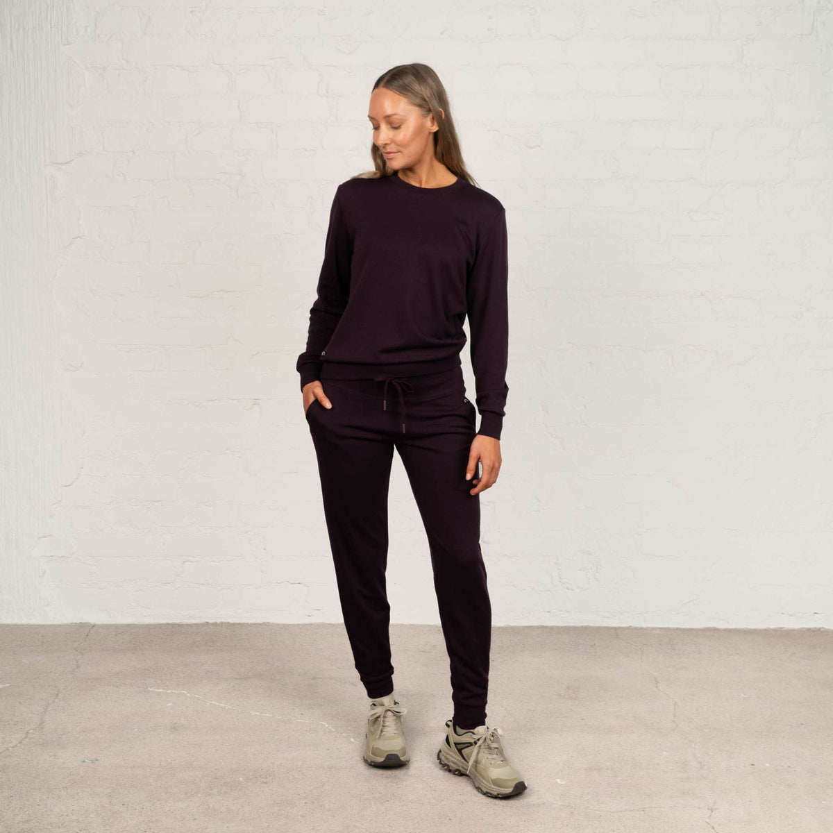 North Outdoor Jona women's merino pants in aubergine mulesing-free merino wool. Designed in Finland. - Model is 174 cm and wears size S
