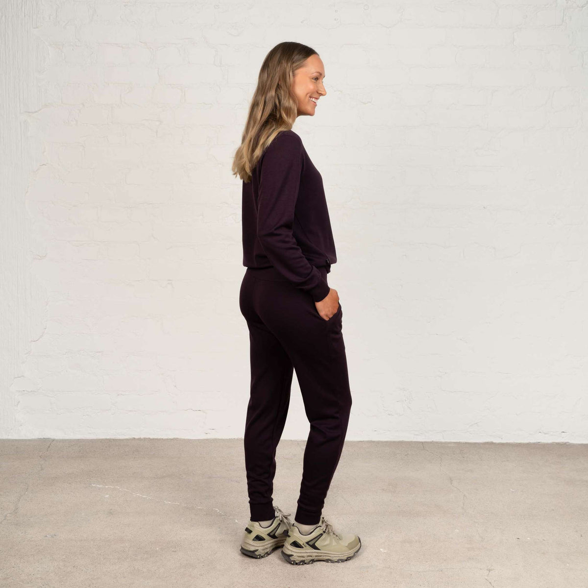 North Outdoor Jona women's merino pants in aubergine mulesing-free merino wool. Designed in Finland. - Model is 174 cm and wears size S