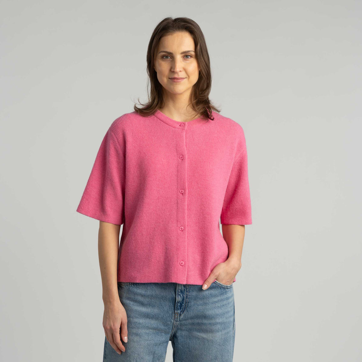 North Outdoor Sointu women's knit cardigan in peony red mulesing-free merino wool. Designed in Finland. - Model is 175 cm and wears size S